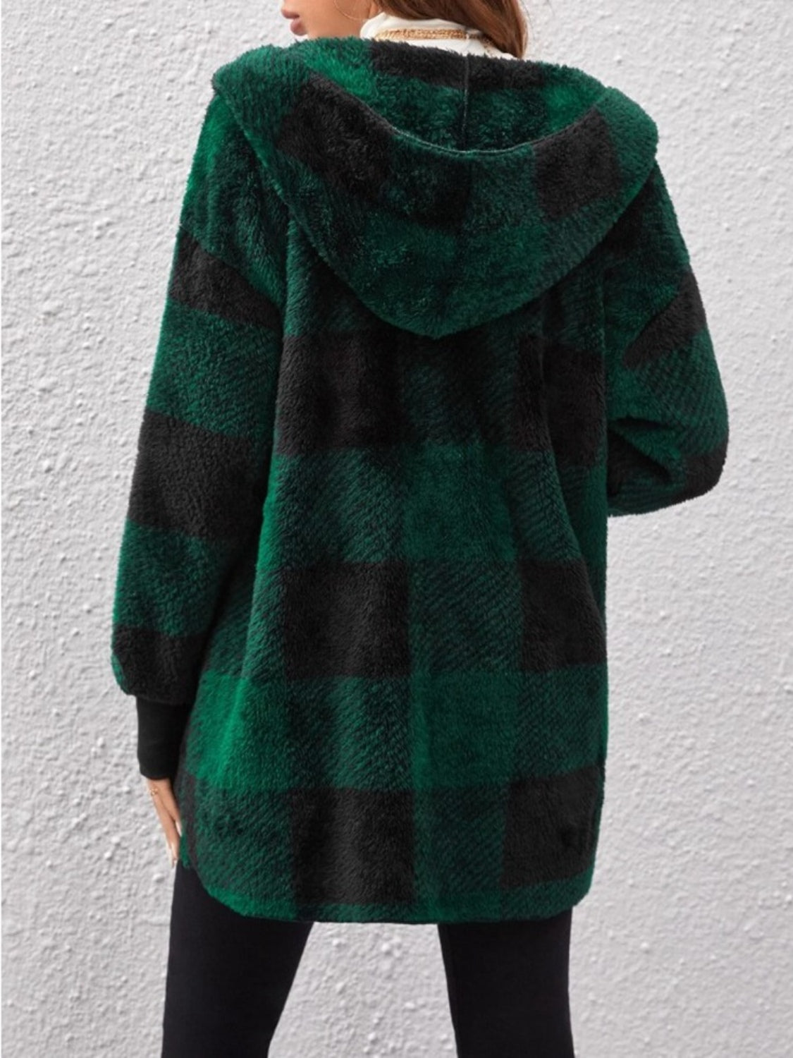 Woman wearing green plaid long sleeve hooded coat made of 100% polyester, showcasing the back view.